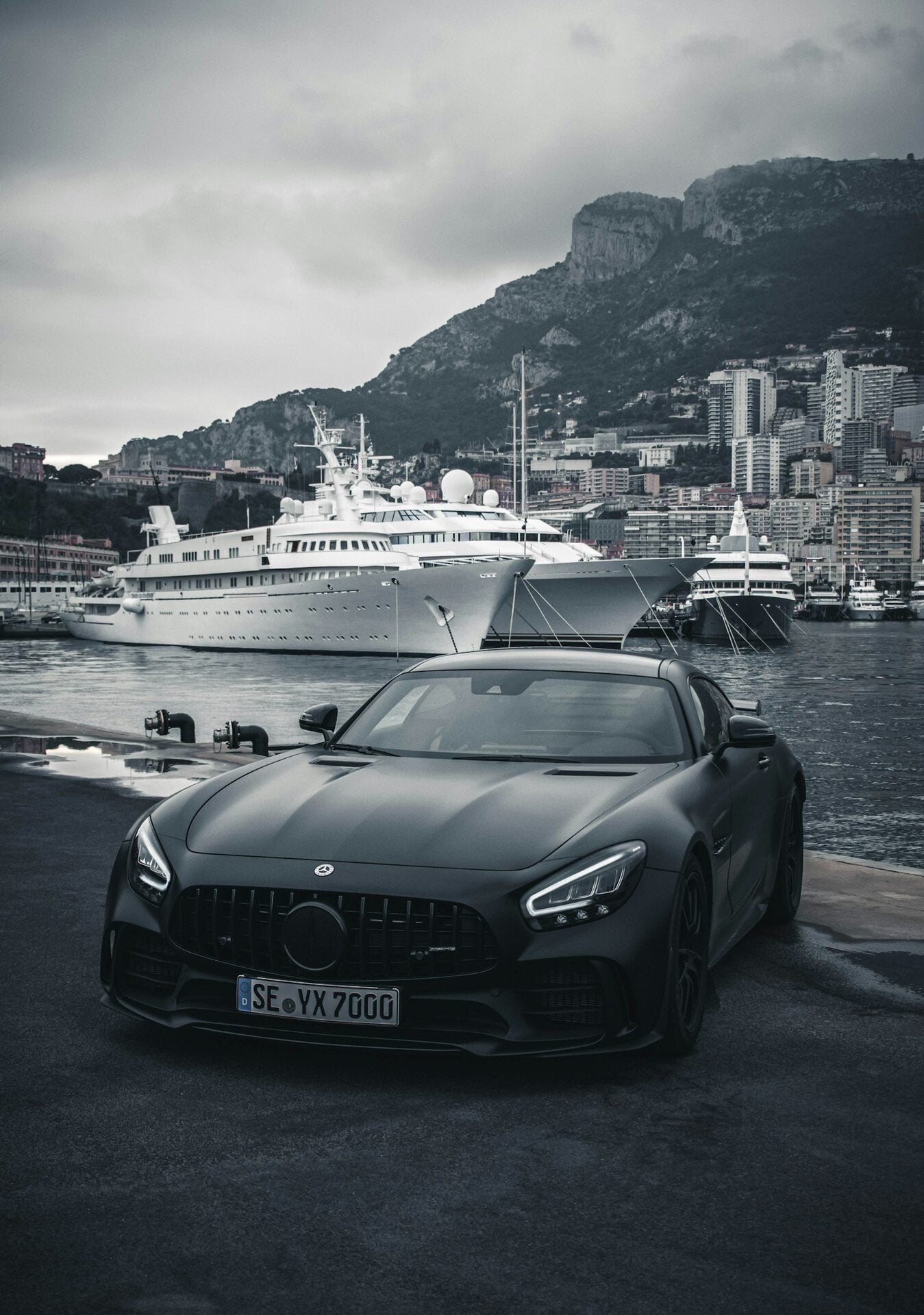 Black Mercedes-AMG GT at a marina