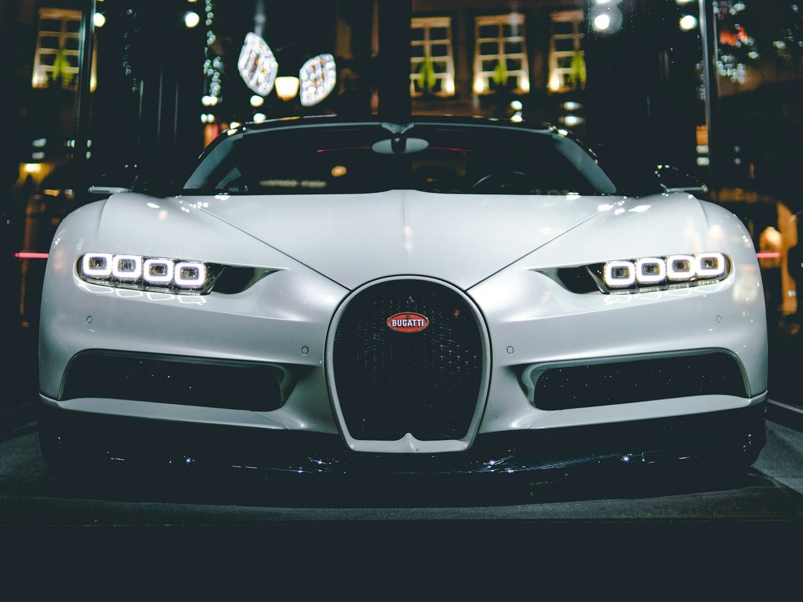 White Bugatti Chiron front view at night