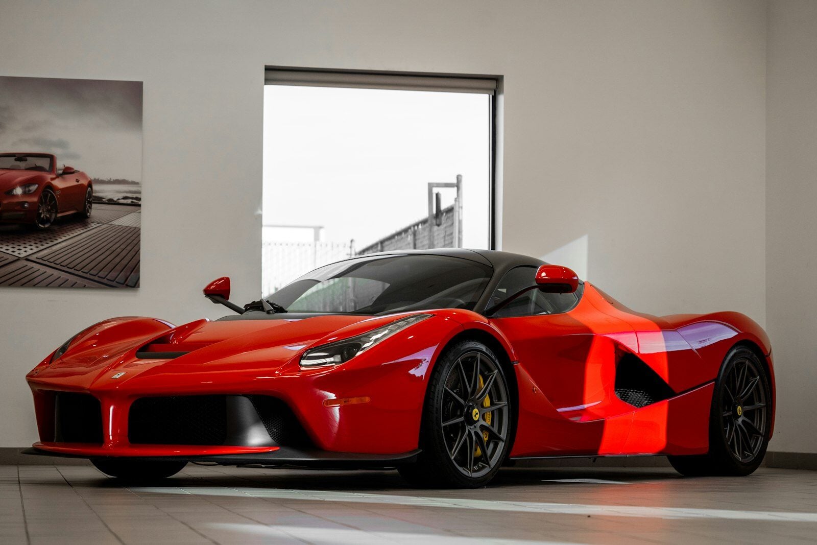 Red Ferrari 488 GTB in a showroom