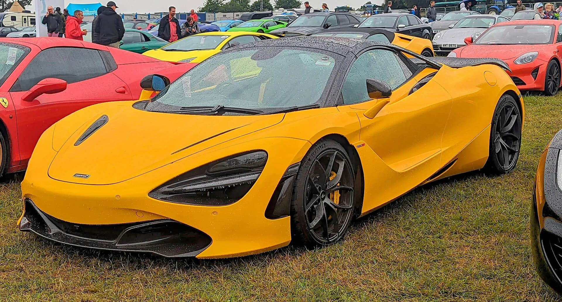 Yellow McLaren 720S at a car show